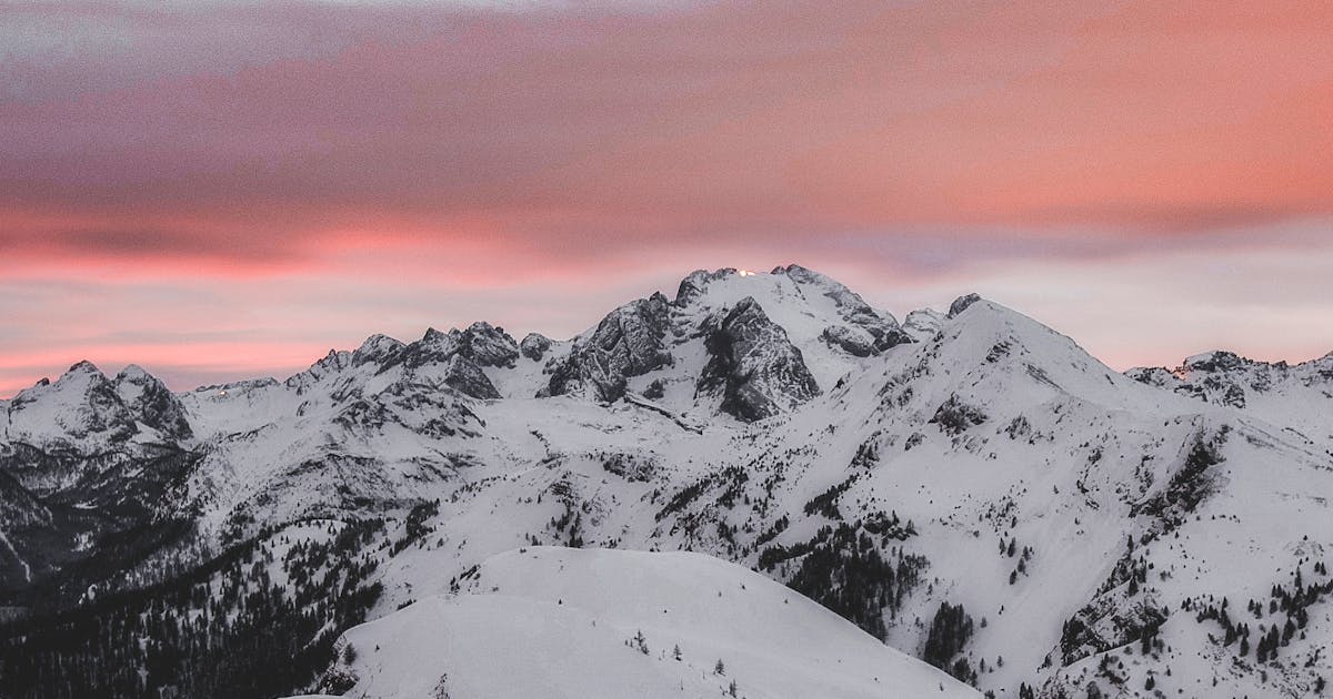 California Golden Gate Bridge with car driving across at sunset