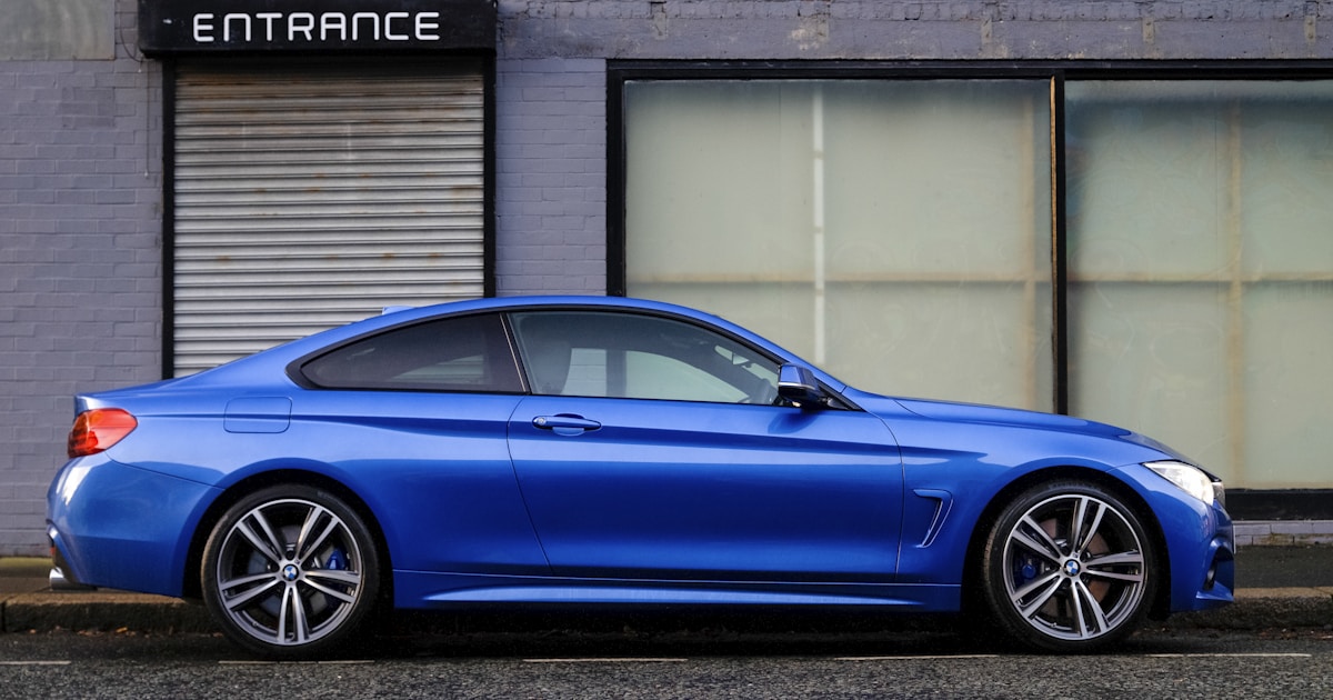 Car parked in garage covered with protective cover representing vehicle storage insurance needs